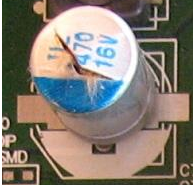 Figura 1 - Capacitor estufado Figura 1 - Capacitor estufado
