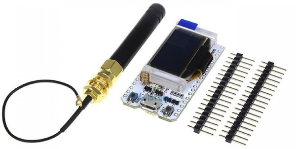 Figura 1 - Módulo WiFi LoRa 32(V2), juntamente com sua antena para o Rádio LoRa e pin-headers
Figura 1 - Módulo WiFi LoRa 32(V2), juntamente com sua antena para o Rádio LoRa e pin-headers